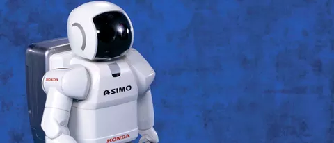 Il robot ASIMO gioca a calcio con Obama